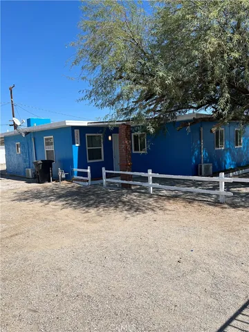 a view of house with yard