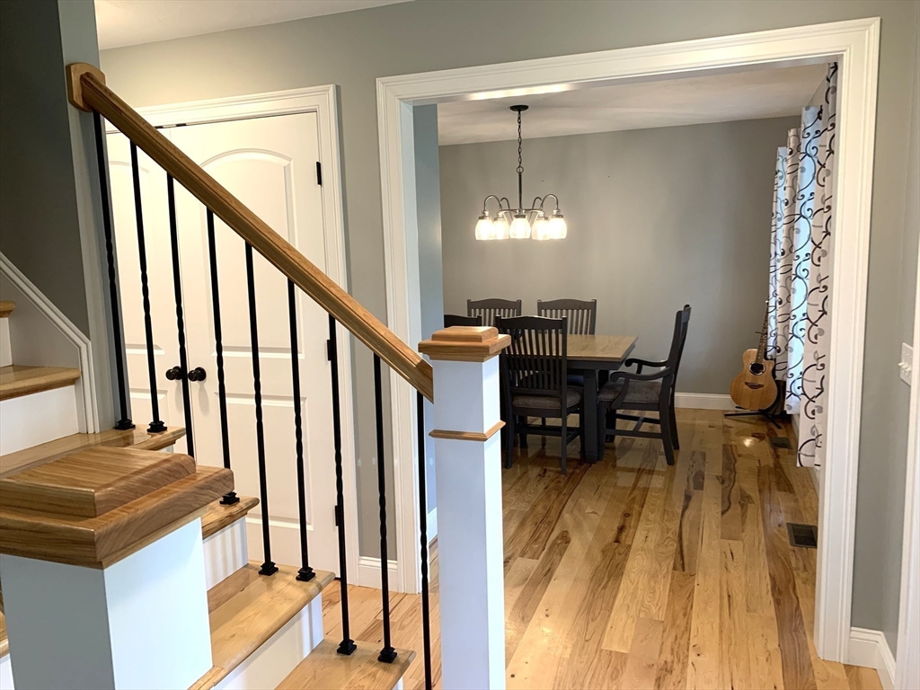 39 Davidson Road Charlton, MA 01507 - Photo 12 of 42 a view of a dining room with furniture and a chandelier