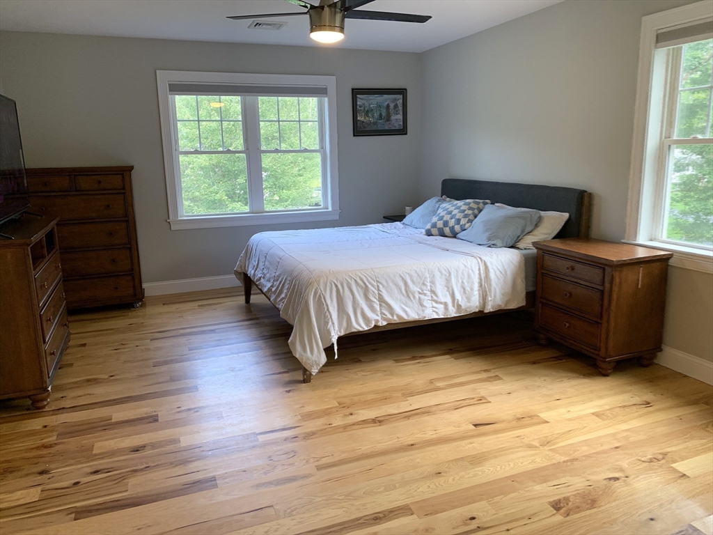 39 Davidson Road Charlton, MA 01507 - Photo 17 of 42 a spacious bedroom with a bed and a window