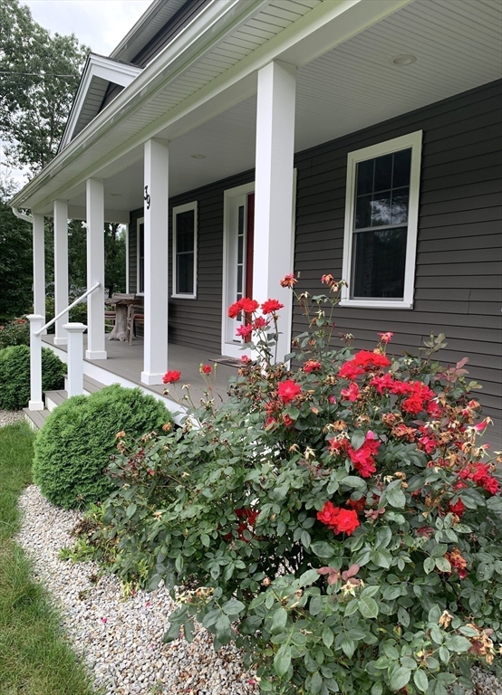 39 Davidson Road Charlton, MA 01507 - Photo 2 of 42 a view of a house that has a flower garden