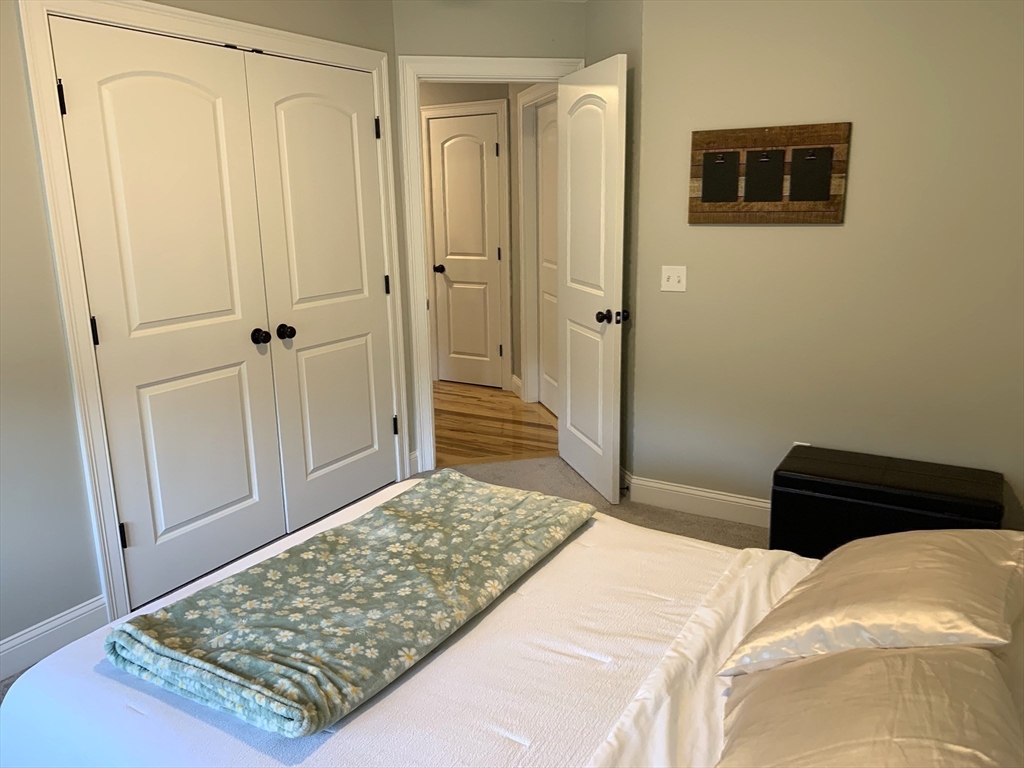 39 Davidson Road Charlton, MA 01507 - Photo 24 of 42 a bedroom with a bed and a table