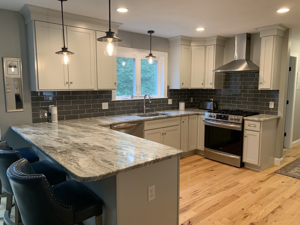 39 Davidson Road Charlton, MA 01507 - Photo 3 of 42 a kitchen with granite countertop a sink a counter top space stainless steel appliances and cabinets
