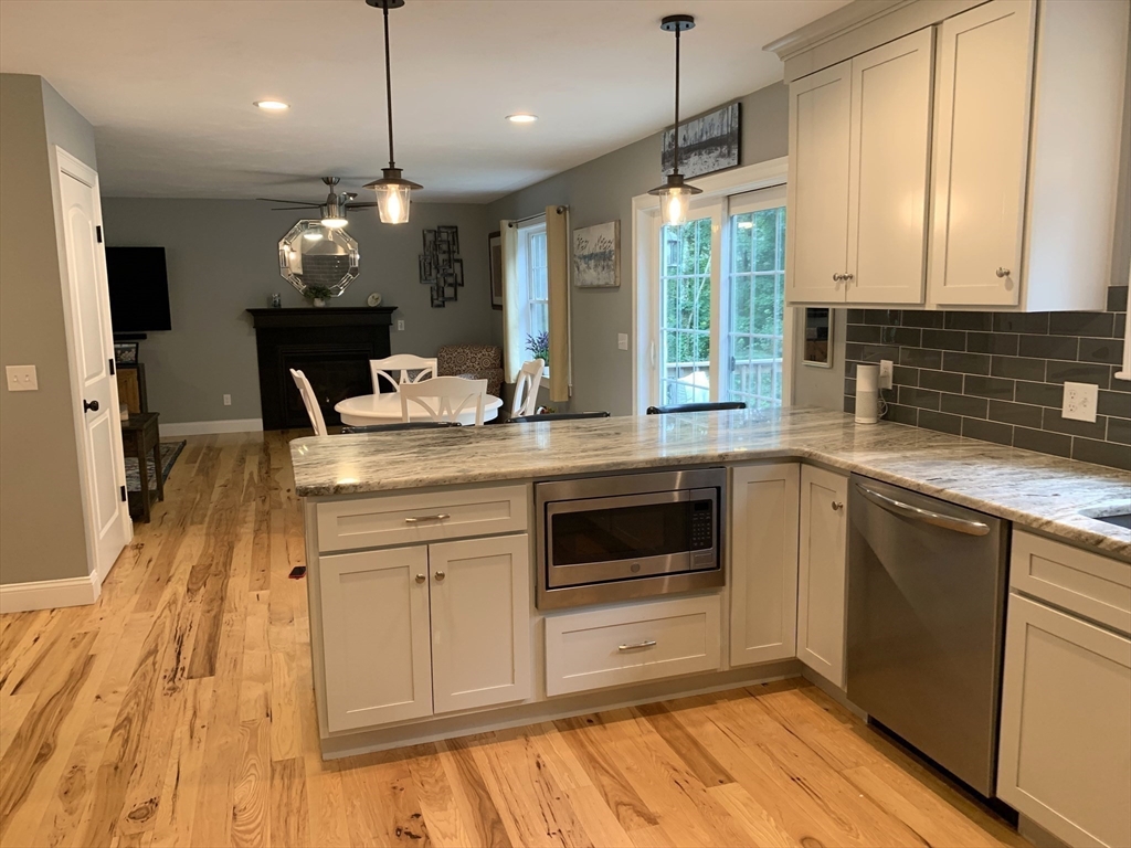 39 Davidson Road Charlton, MA 01507 - Photo 6 of 42 a kitchen with a sink stove and microwave