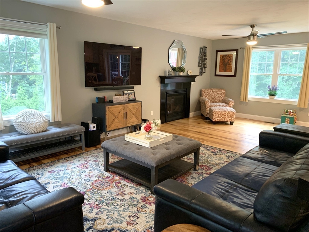 39 Davidson Road Charlton, MA 01507 - Photo 10 of 42 a living room with furniture and a flat screen tv