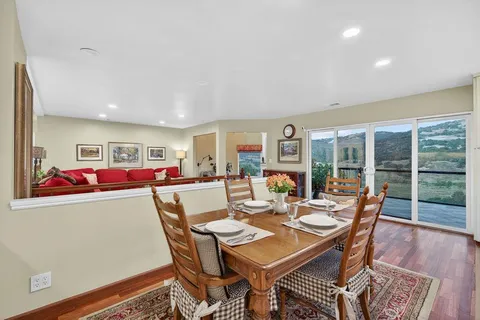 a living room with furniture fireplace and flat screen tv