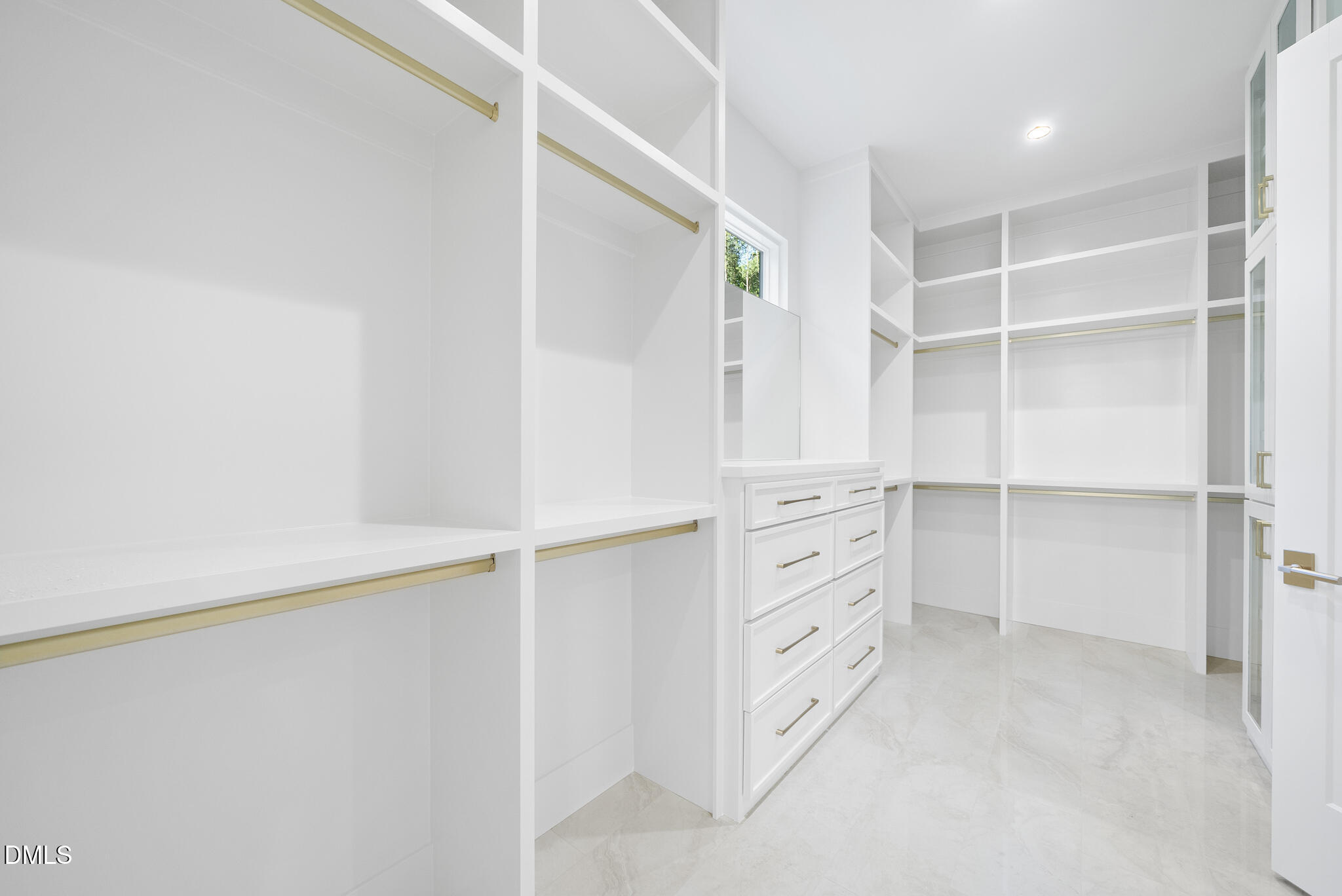 7608 Falls Creek Lane Raleigh, NC 27614 - Photo 38 of 74 a view of walk in closet with empty racks