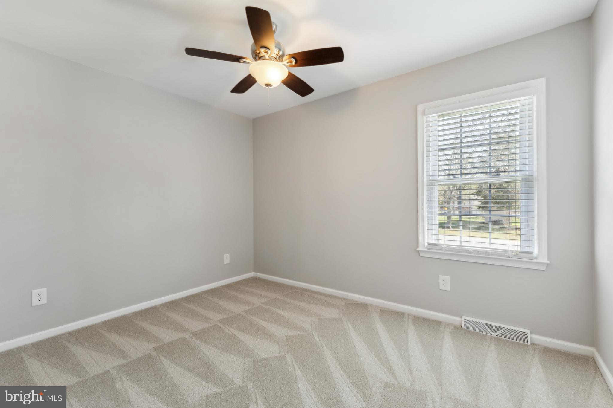 7461 Robin Road La Plata, MD 20646 - Photo 12 of 30 an empty room with a window and a fan