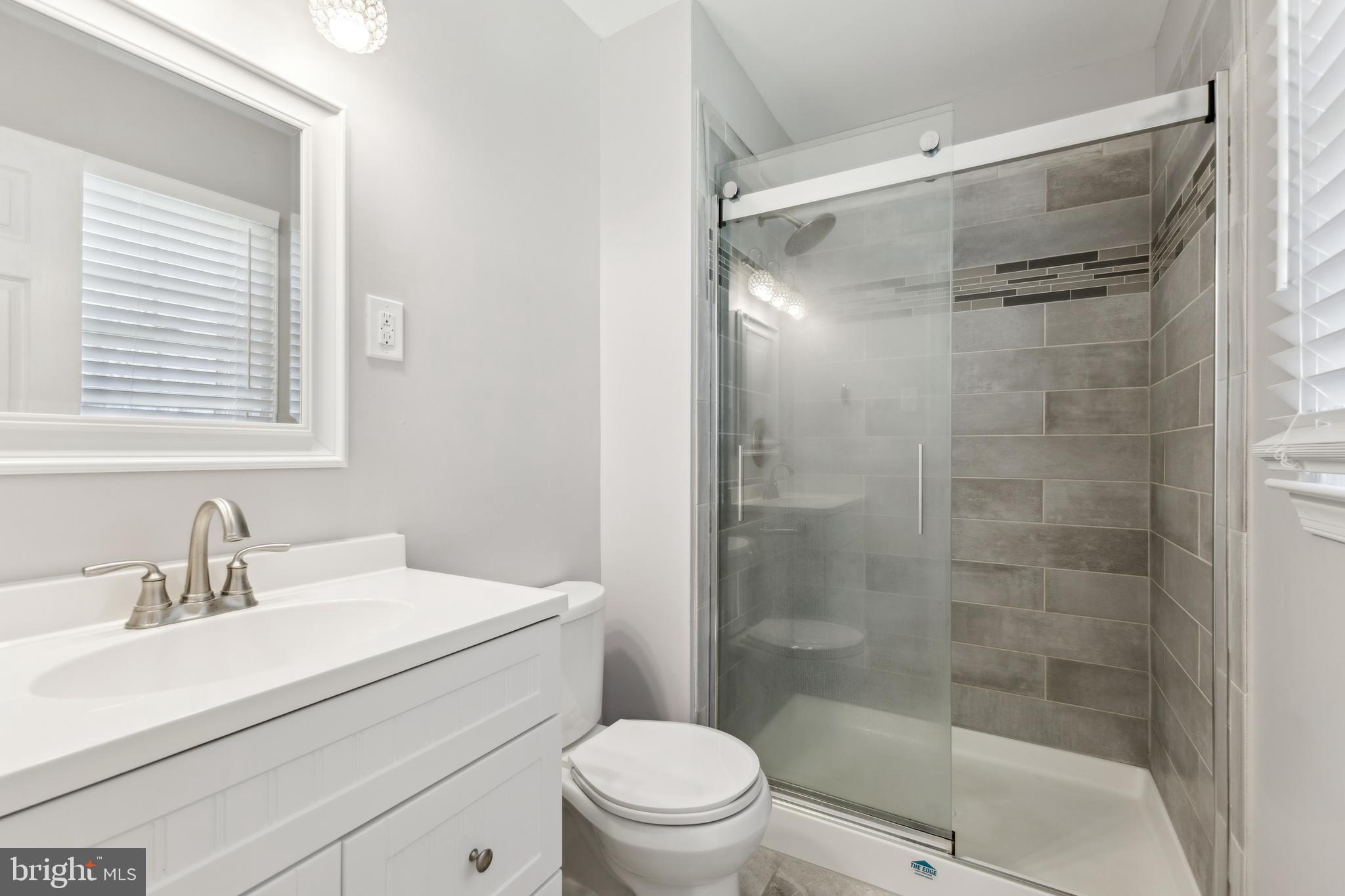 7461 Robin Road La Plata, MD 20646 - Photo 17 of 30 a bathroom with a sink mirror vanity and toilet
