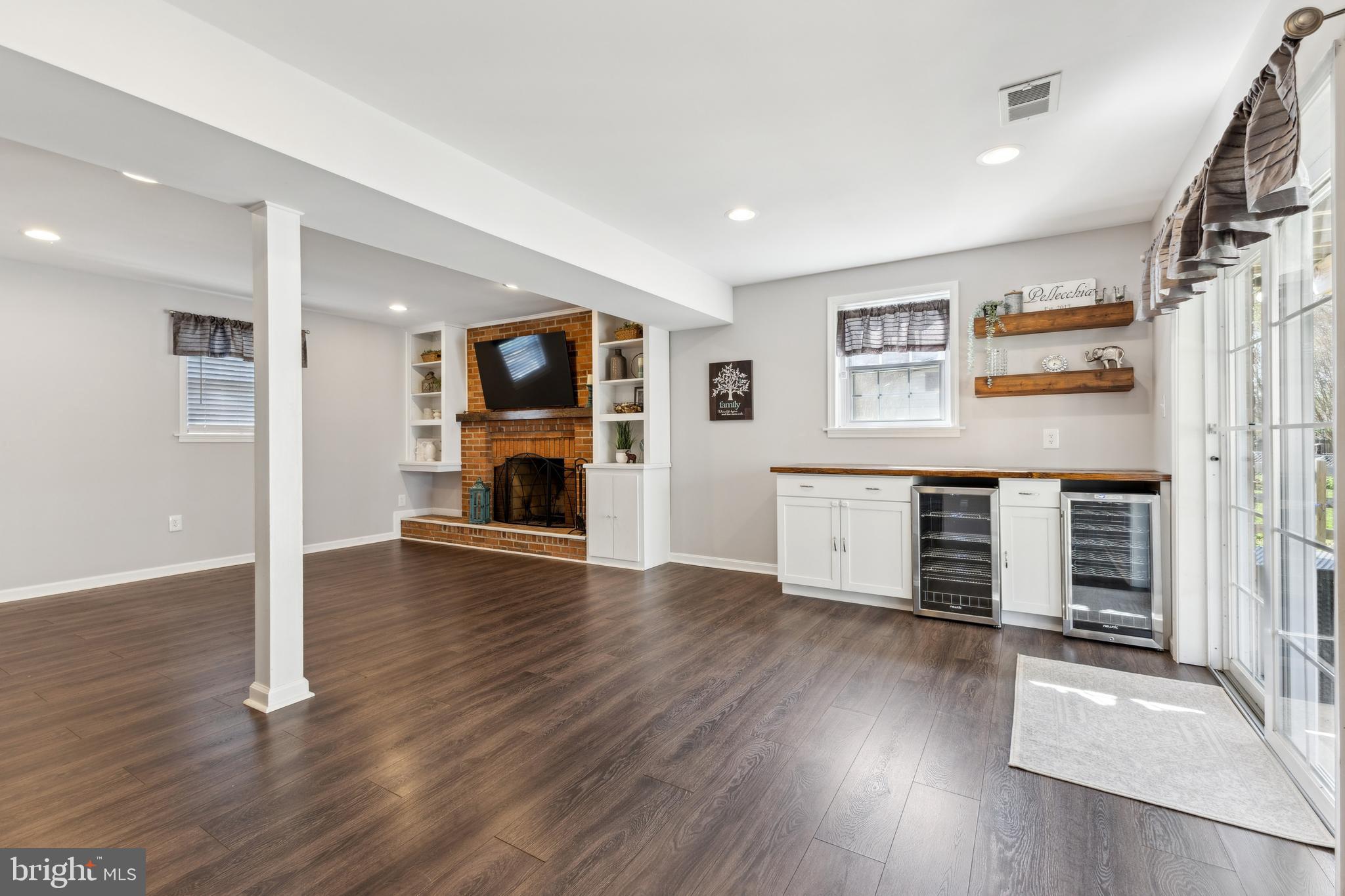 7461 Robin Road La Plata, MD 20646 - Photo 18 of 30 an empty room with wooden floor and windows