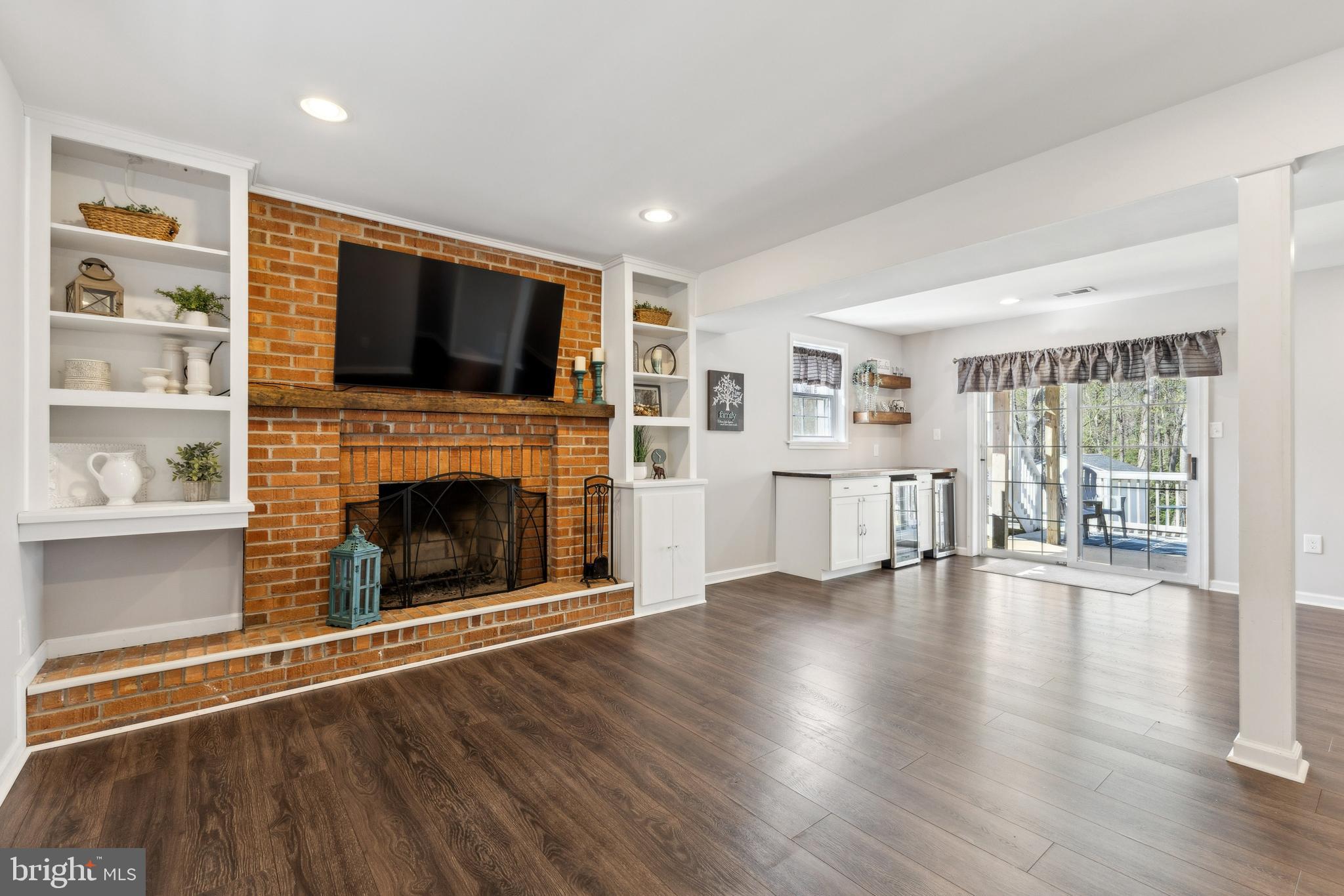 7461 Robin Road La Plata, MD 20646 - Photo 19 of 30 a view of a livingroom with wooden floor and a fireplace