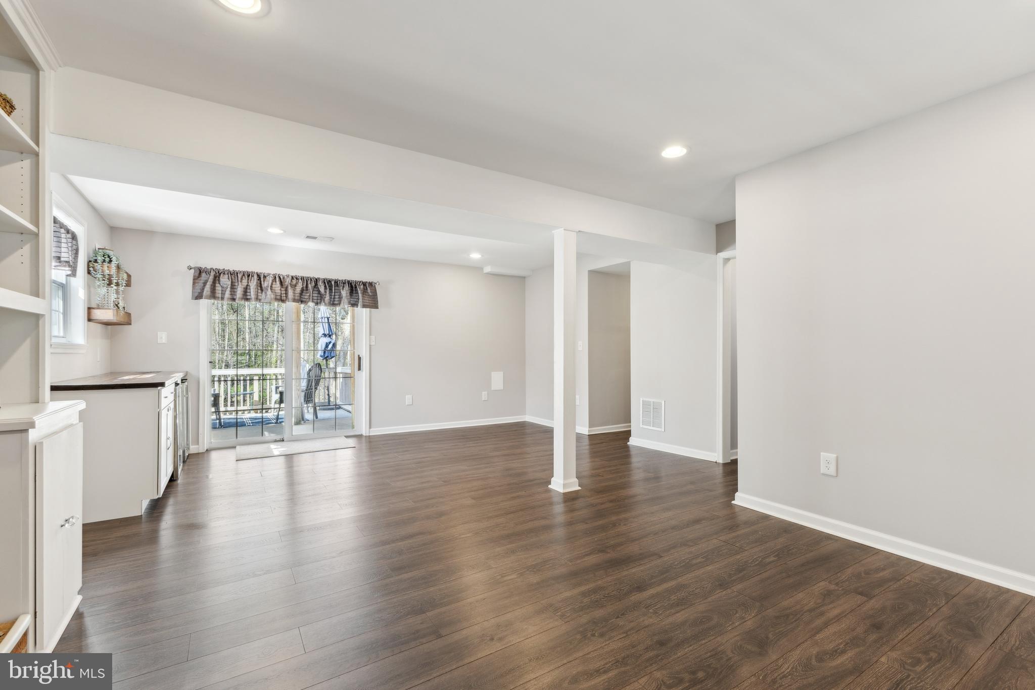 7461 Robin Road La Plata, MD 20646 - Photo 20 of 30 a view of an empty room with wooden floor and a window