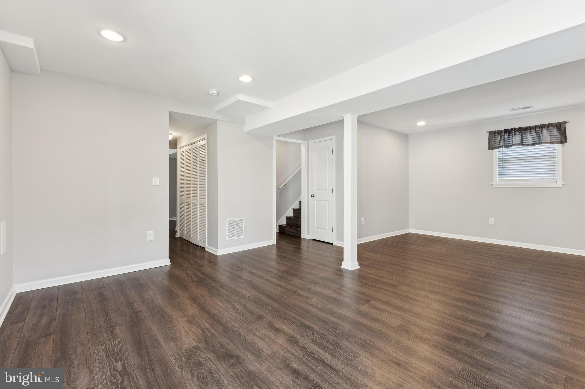 7461 Robin Road La Plata, MD 20646 - Photo 21 of 30 a view of an empty room with wooden floor and closet