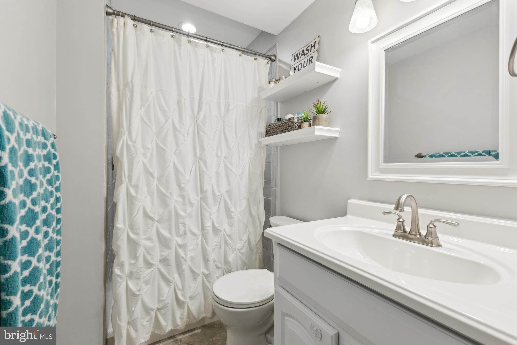 7461 Robin Road La Plata, MD 20646 - Photo 22 of 30 a bathroom with a sink and toilet