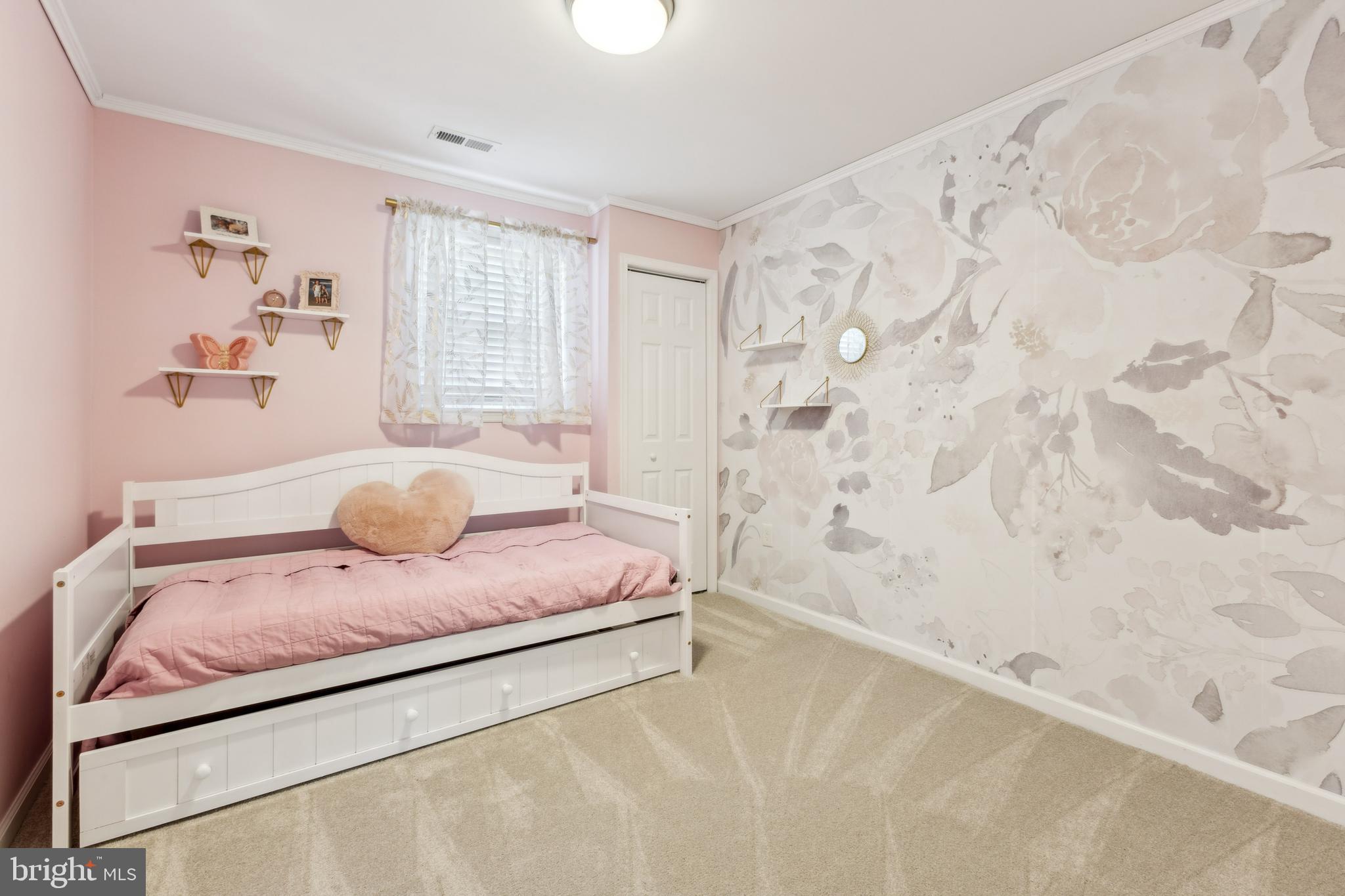 7461 Robin Road La Plata, MD 20646 - Photo 23 of 30 a bedroom with a bed and wooden floor