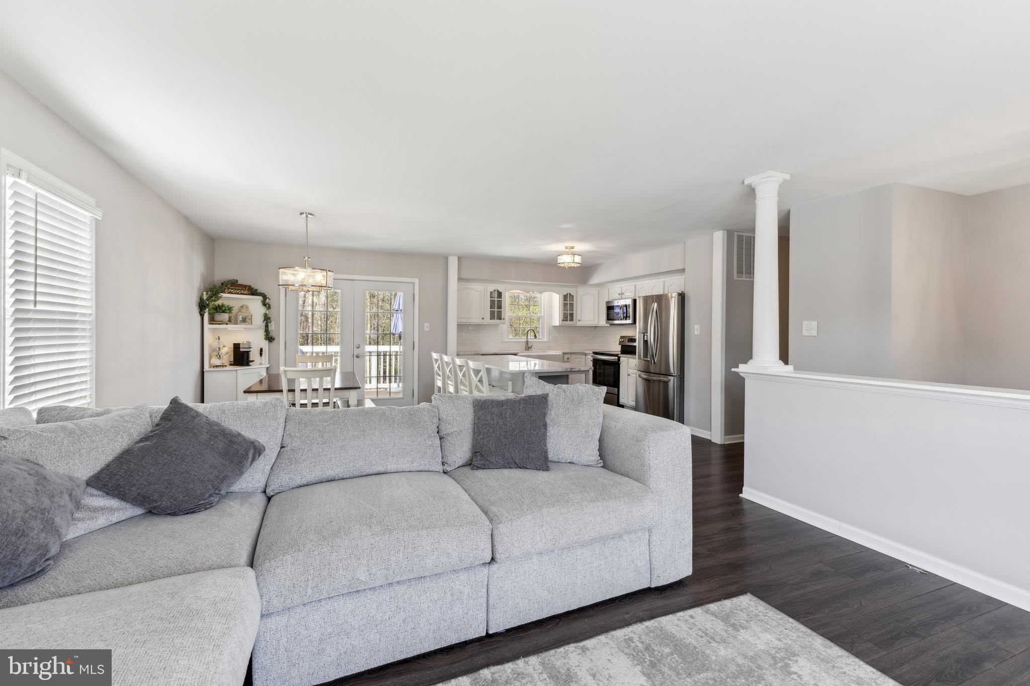 7461 Robin Road La Plata, MD 20646 - Photo 6 of 30 a living room with furniture white walls and white walls