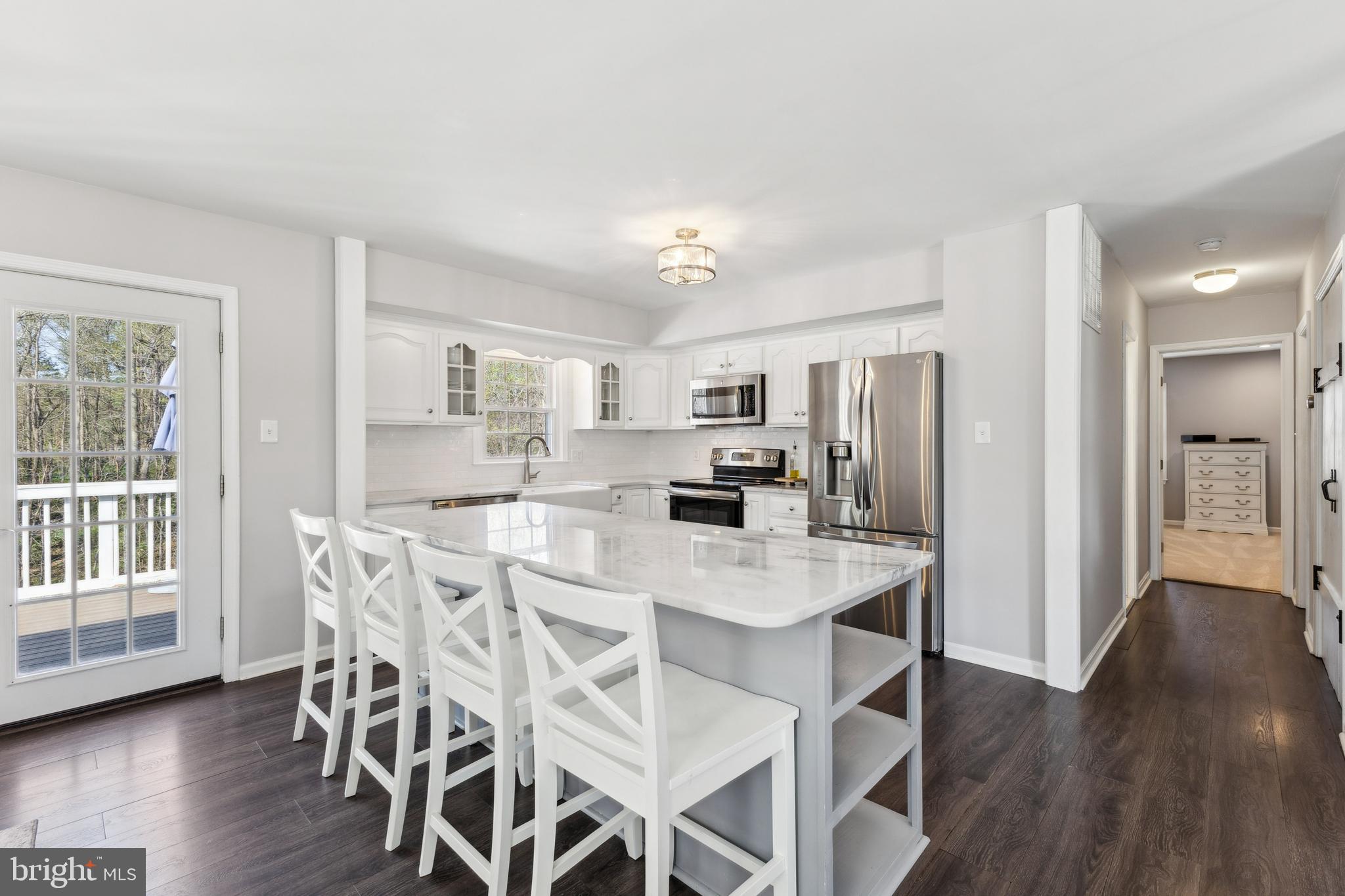 7461 Robin Road La Plata, MD 20646 - Photo 8 of 30 a view of a dining room with furniture and wooden floor