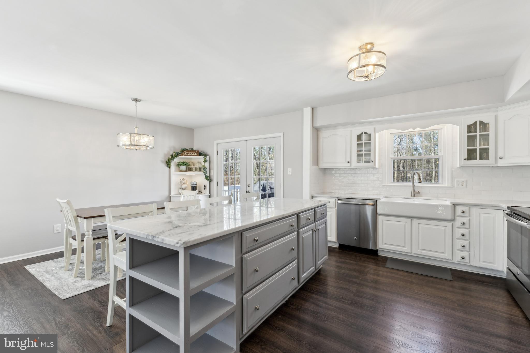 7461 Robin Road La Plata, MD 20646 - Photo 9 of 30 a large white kitchen with cabinets
