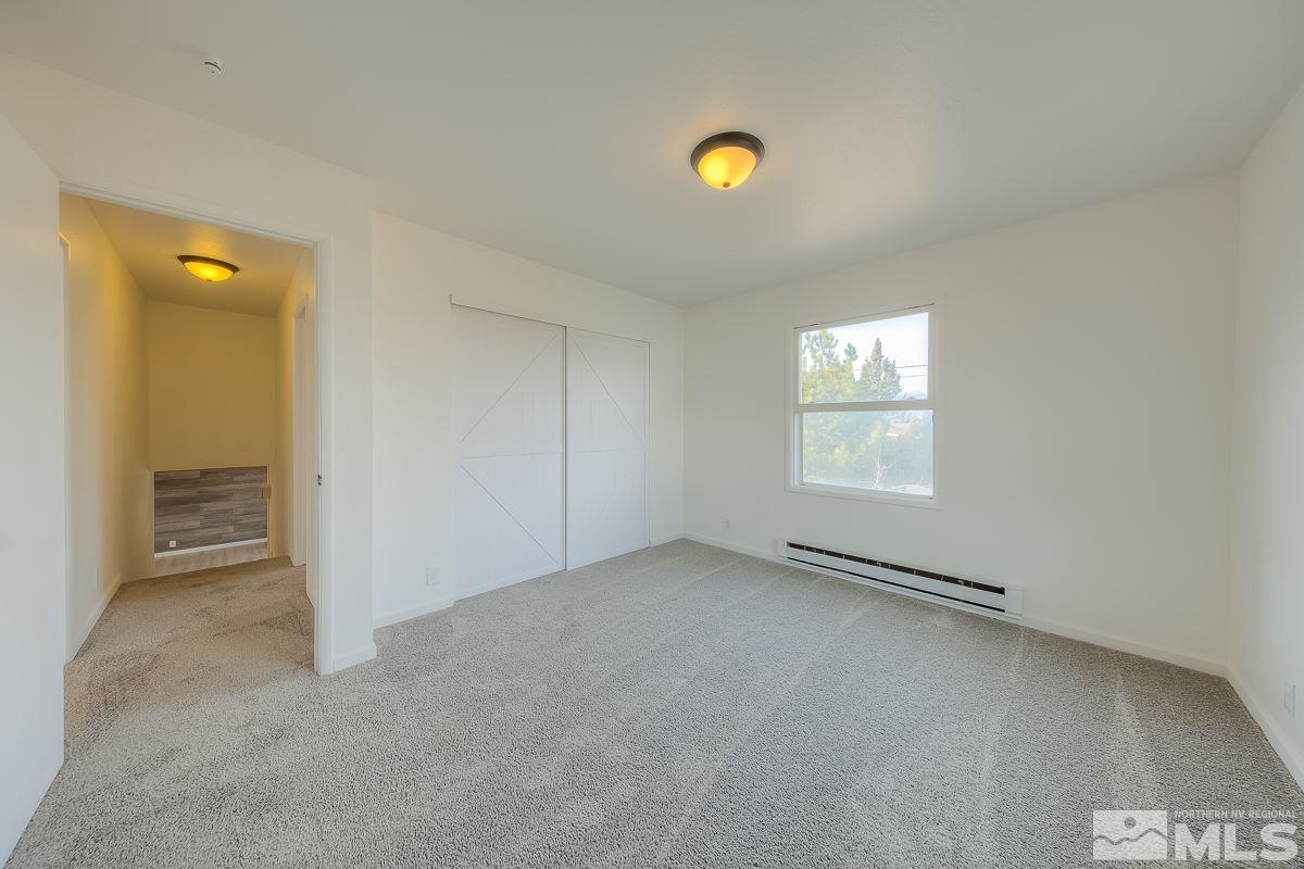 13830 Virginia Foothills Drive Reno, NV 89521 - Photo 13 of 25 an empty room with windows