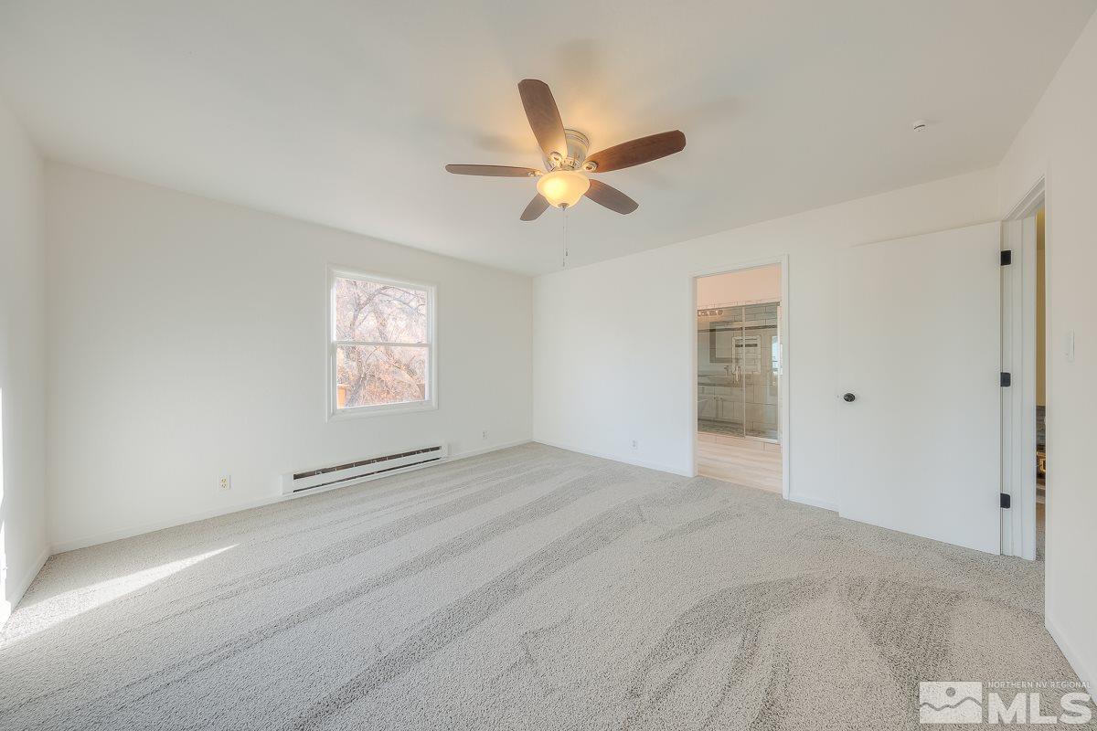 13830 Virginia Foothills Drive Reno, NV 89521 - Photo 8 of 25 a view of empty room with window and ceiling fan