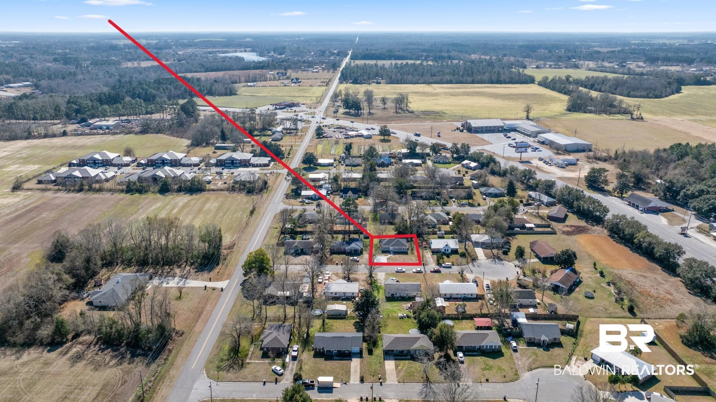 76 Fincher Lane Loxley, AL 36551 - Photo 32 of 33 Aerial overview of property's location with nearby suburban area