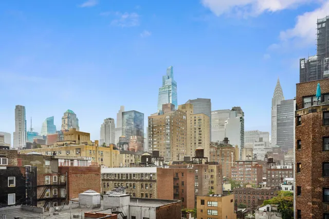 a view of city and a tall buildings