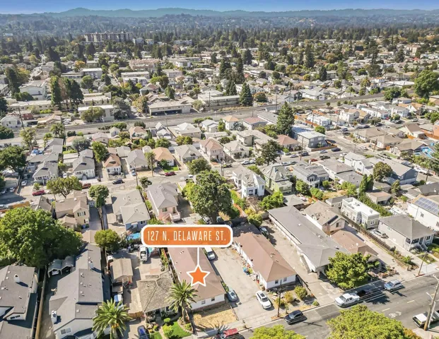 an aerial view of residential building with parking space