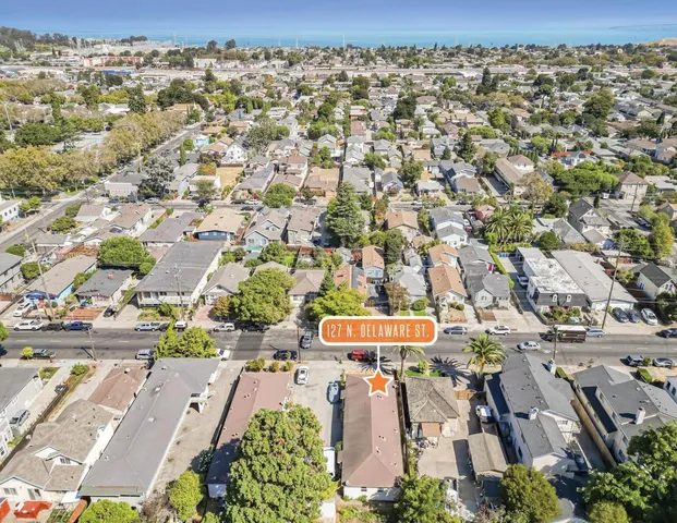 an aerial view of a city with lots of residential buildings