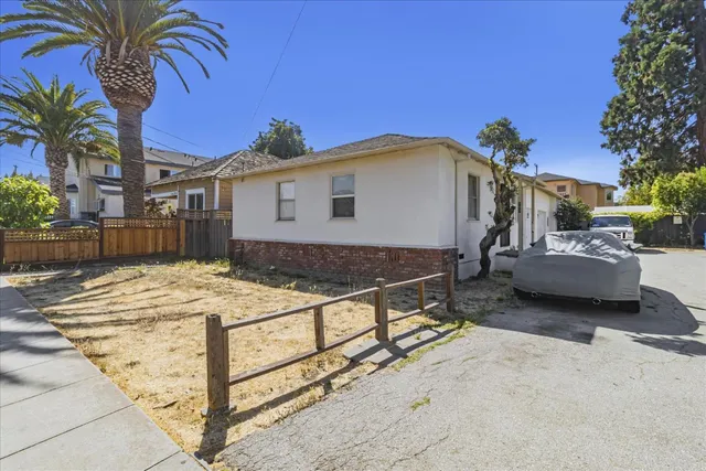 a view of a house with a bed and chair