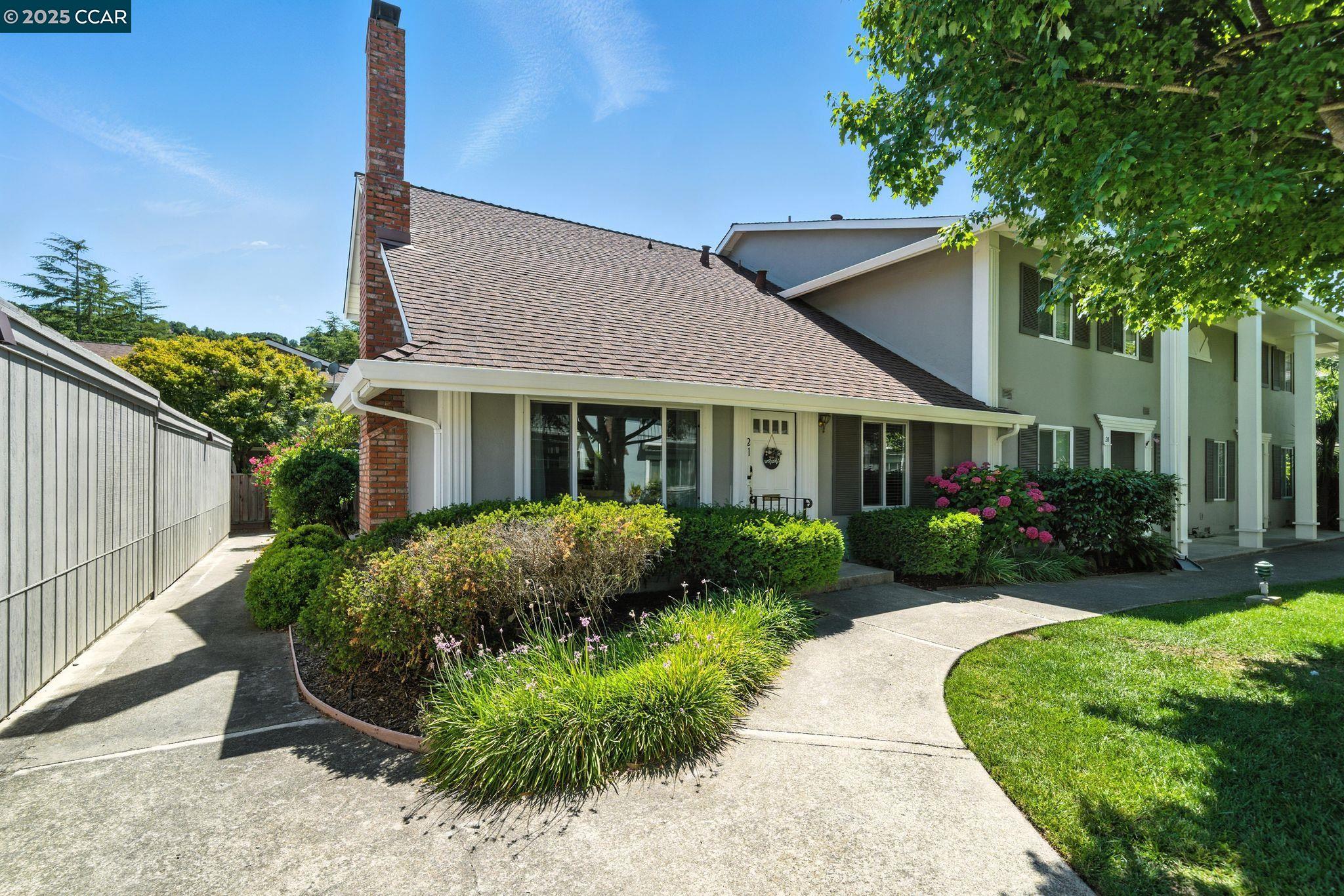 front view of a house with a yard