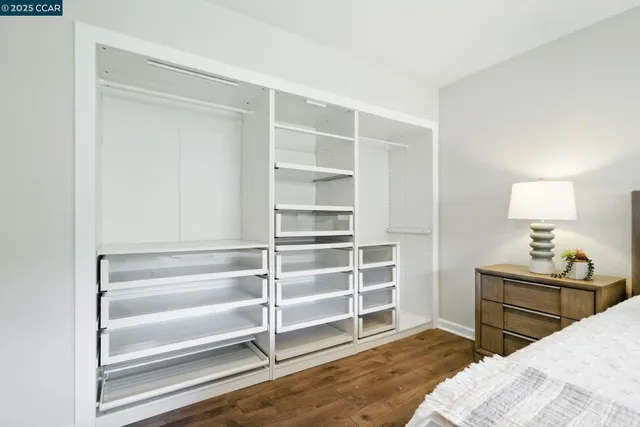 a bedroom with a bed and a cabinets