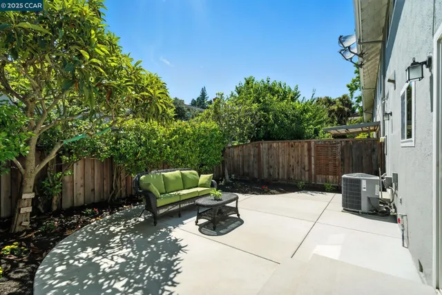 a view of backyard with seating space