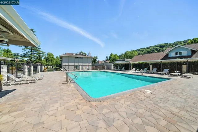 a view of a swimming pool and a chairs