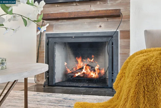 a view of a living room with a fireplace