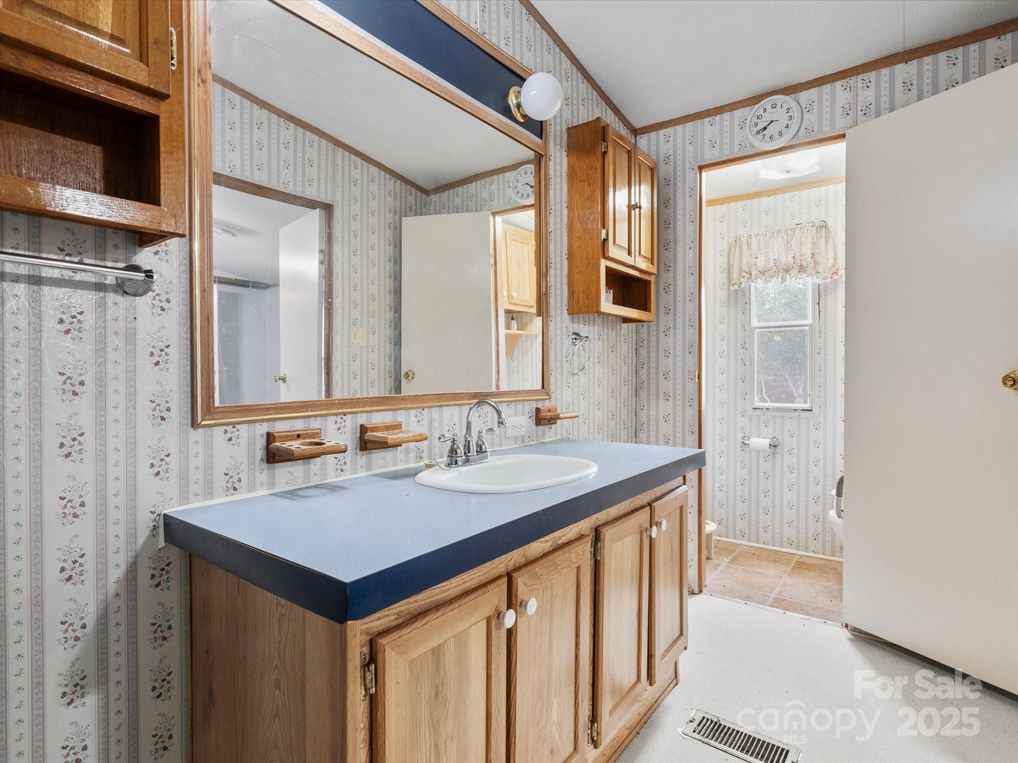 3231 Rocky Ridge Road Wallace, SC 29596 - Photo 17 of 35 a bathroom with a sink and a mirror