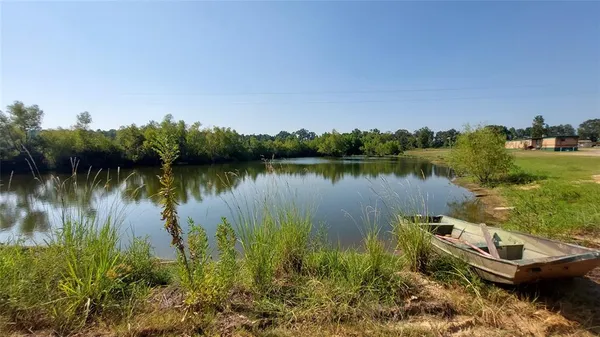 a view of a lake with a yard