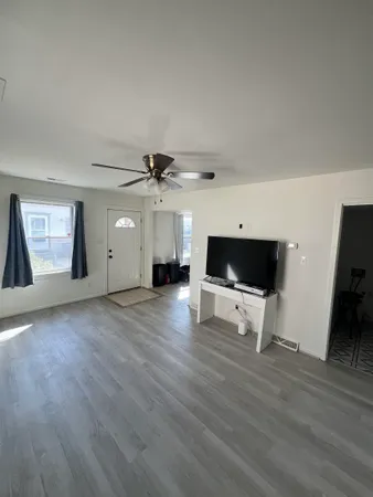 a view of livingroom with furniture and wooden floor