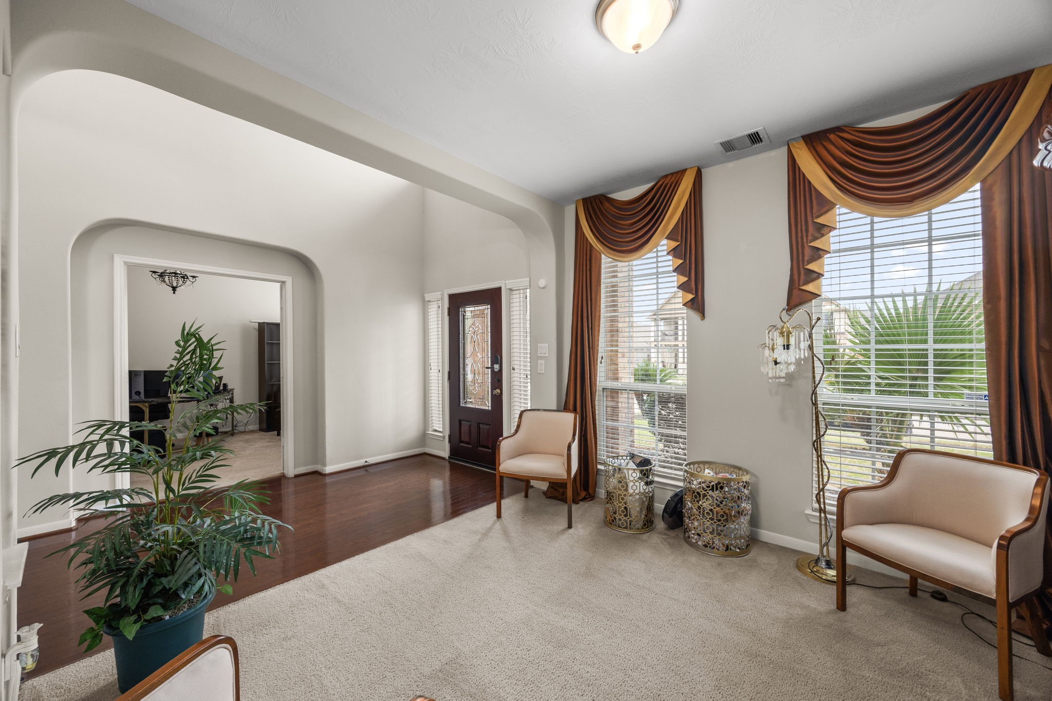 6719 Latchmore Lane Houston, TX 77049 - Photo 20 of 46 a living room with furniture and a large window