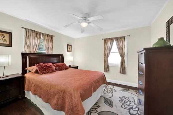 a bedroom with a large bed and a window