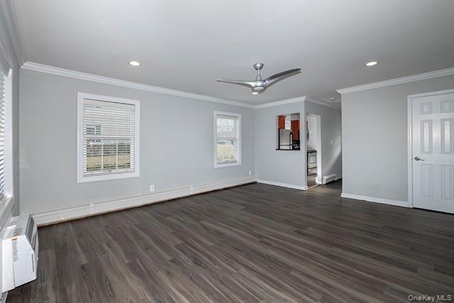 184 Hallock Road, Unit 6B1 Lake Grove, NY 11755 - Photo 3 of 8 a view of empty room with wooden floor and fan