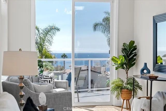 a kitchen with a white cabinets and chairs
