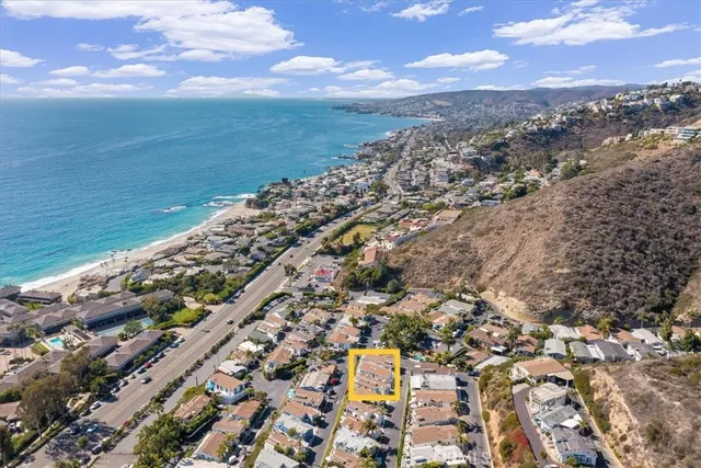a kitchen with stainless steel appliances granite countertop a refrigerator sink and stove