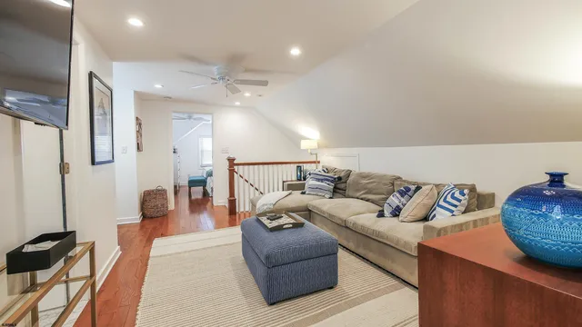 a living room with furniture and a rug