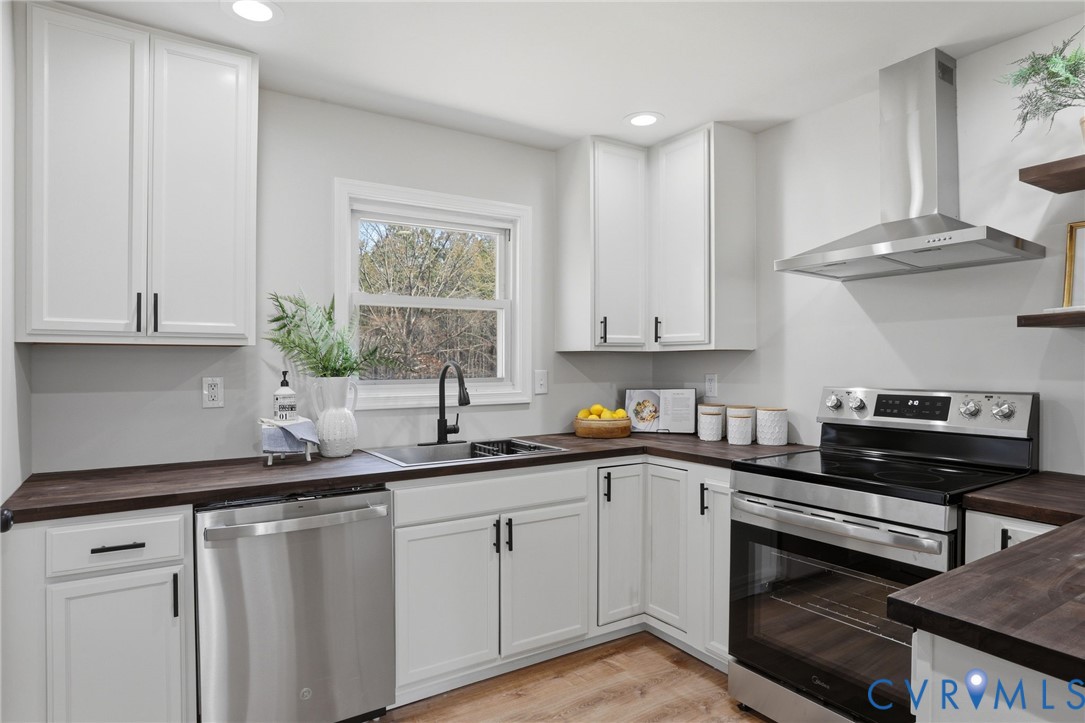 3490 Willow Brook Road Bumpass, VA 23024 - Photo 9 of 29 a kitchen with a sink stove and cabinets