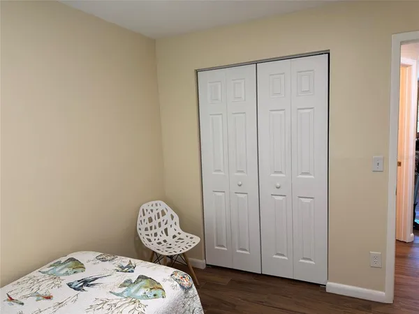 a bedroom with a bed and a table in it