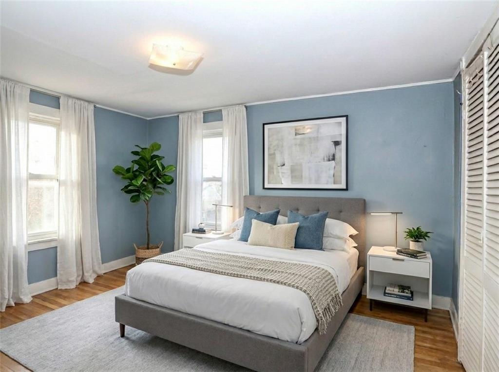 636 Holmdel Road Hazlet, NJ 07730 - Photo 22 of 47 a bedroom with a bed and a potted plant