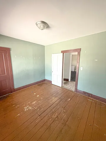 a view of a room with toys and wooden floor