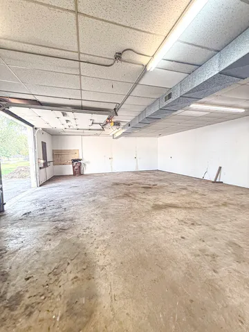 a bathroom with a sink mirror and toilet