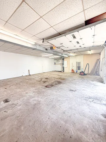 a large kitchen with stainless steel appliances granite countertop a large stove a refrigerator a sink dishwasher with a cabinets and wooden floor