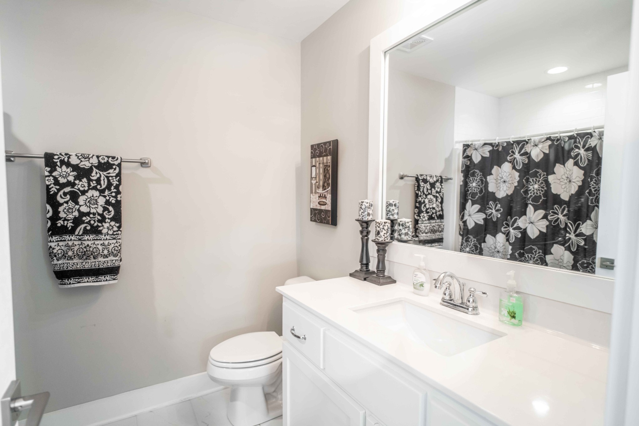 810 Stovers Glen Drive Murfreesboro, TN 37128 - Photo 13 of 21 a bathroom with a sink a toilet and a large mirror