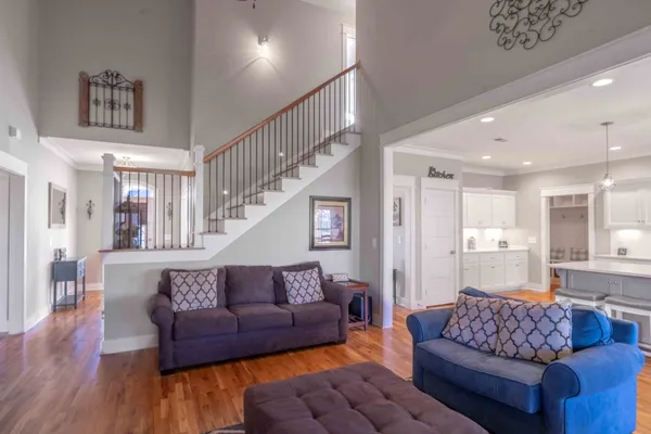 a living room with furniture and a large window